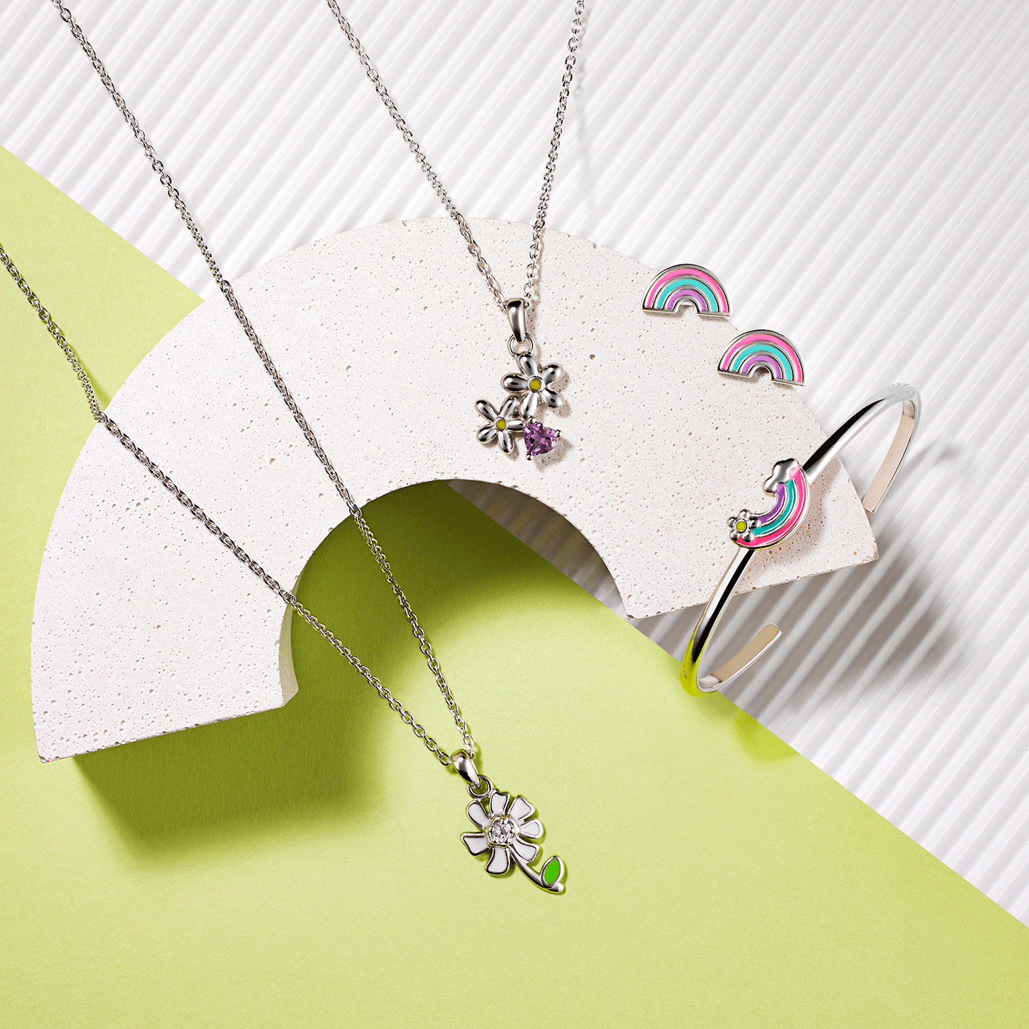 Collection of items including silver daisy with sapphire and flowers with hearts pendants and matching rainbow adjustable cuff and earrings