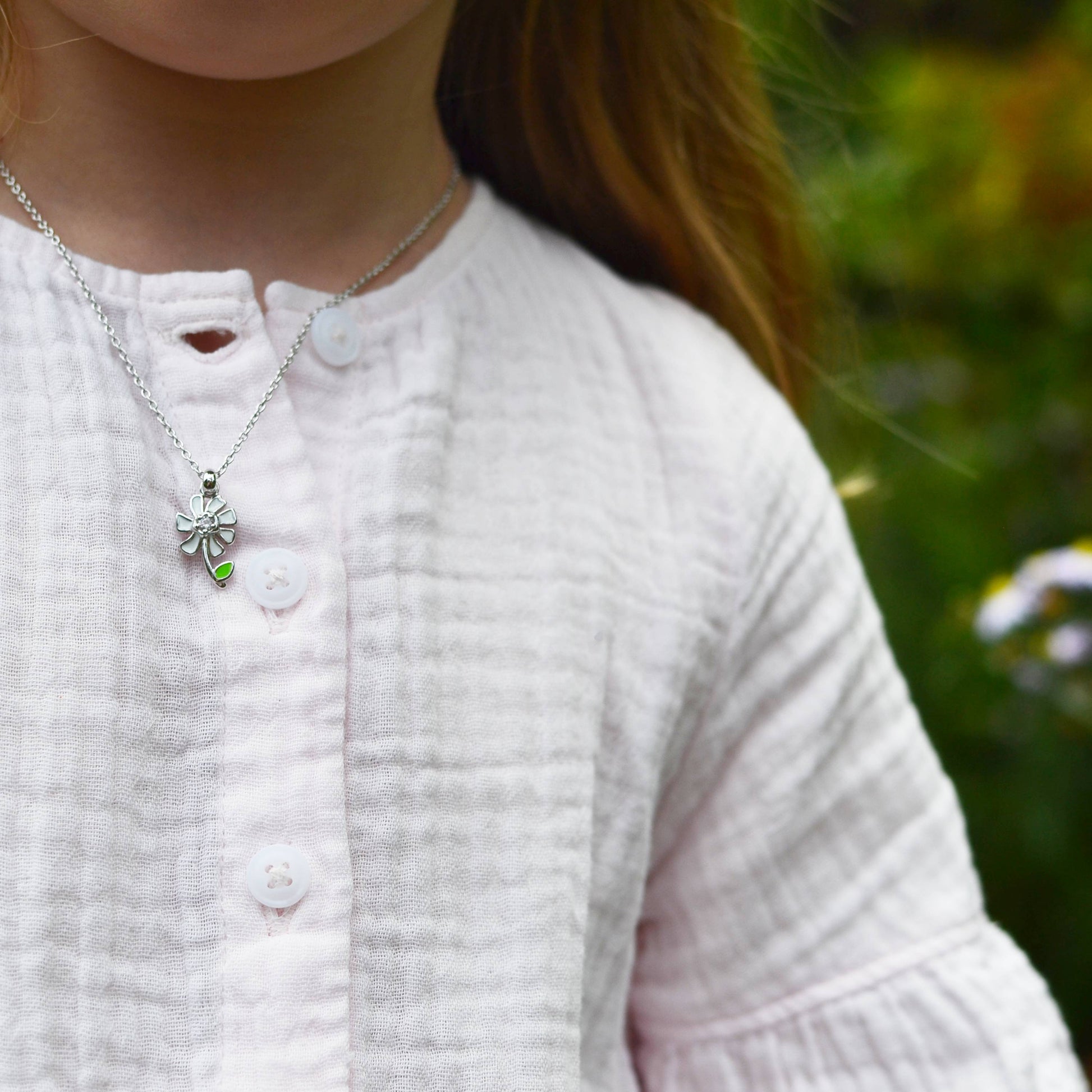 Little girl wearing Sterling Silver Sweet Daisy Pendant with Sapphire on an Extendable Chain Necklace