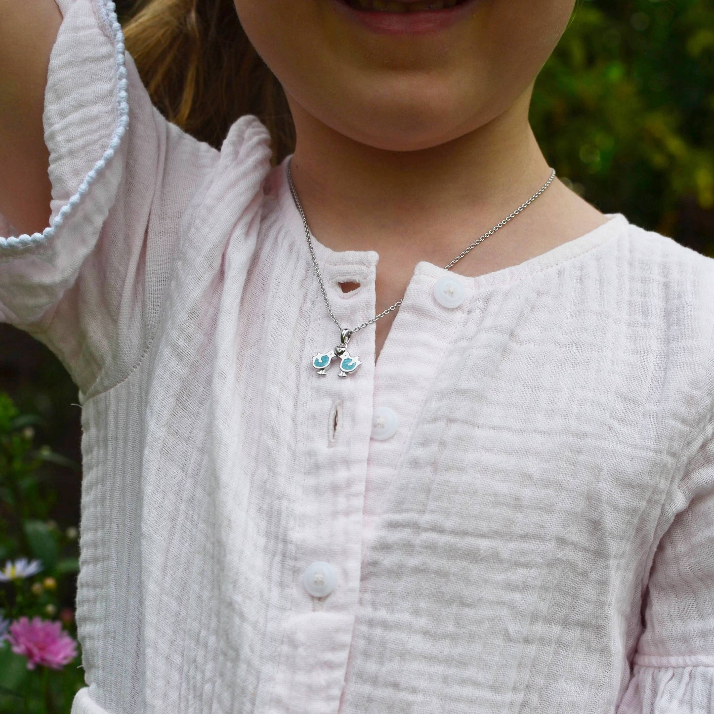 Little girl wearing Sterling Silver Love Birds with Diamond Heart and Enamel Pendant on an Extendable Chain Necklace