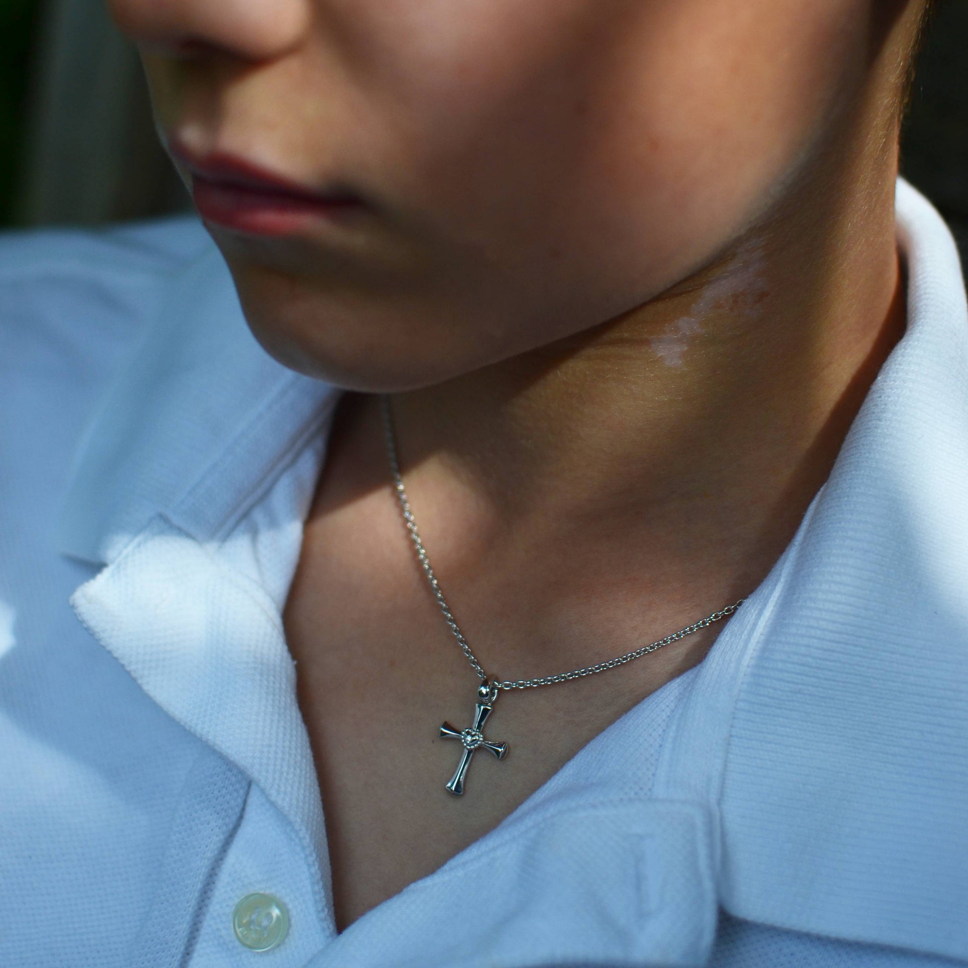 Boy wearing Sterling Silver Cross with Heart and Diamond Pendant on an Extendable Chain Necklace
