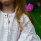 Little girl wearing Children's Silver Sunflower with Yellow Enamel Pendant on an Extendable Chain Necklace